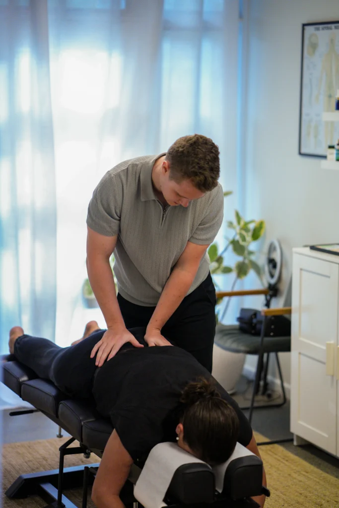 Dr Ben performing Chiropractic adjustment on a patient