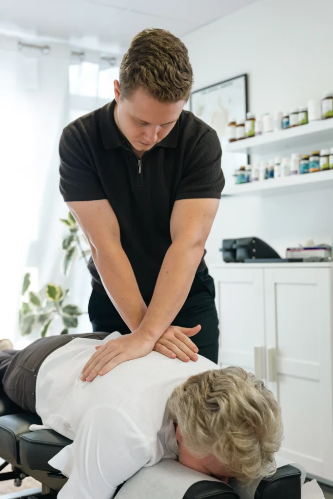 Dr Ben performing chiropractic adjustment