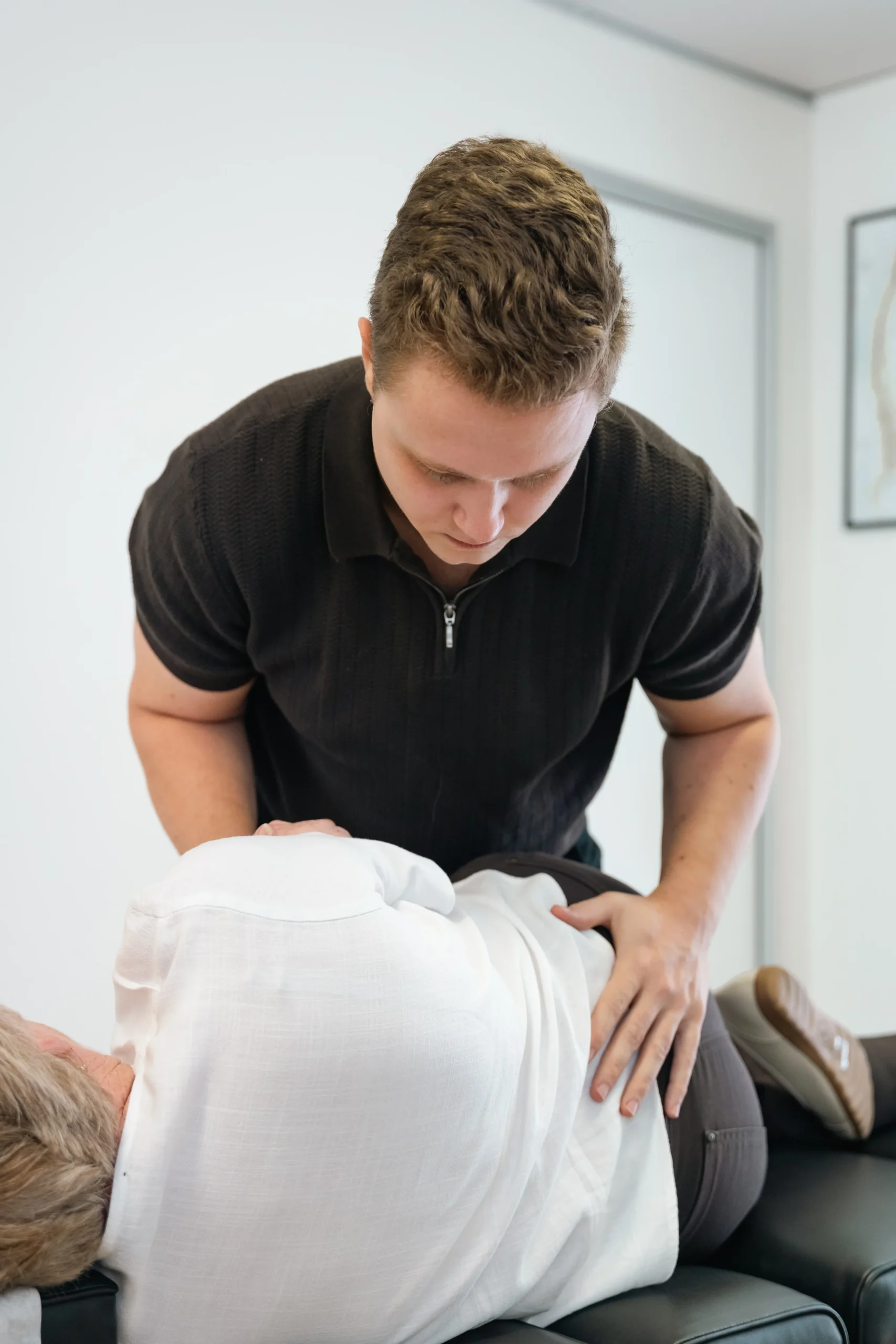 Dr Ben performing chiropractic adjustment