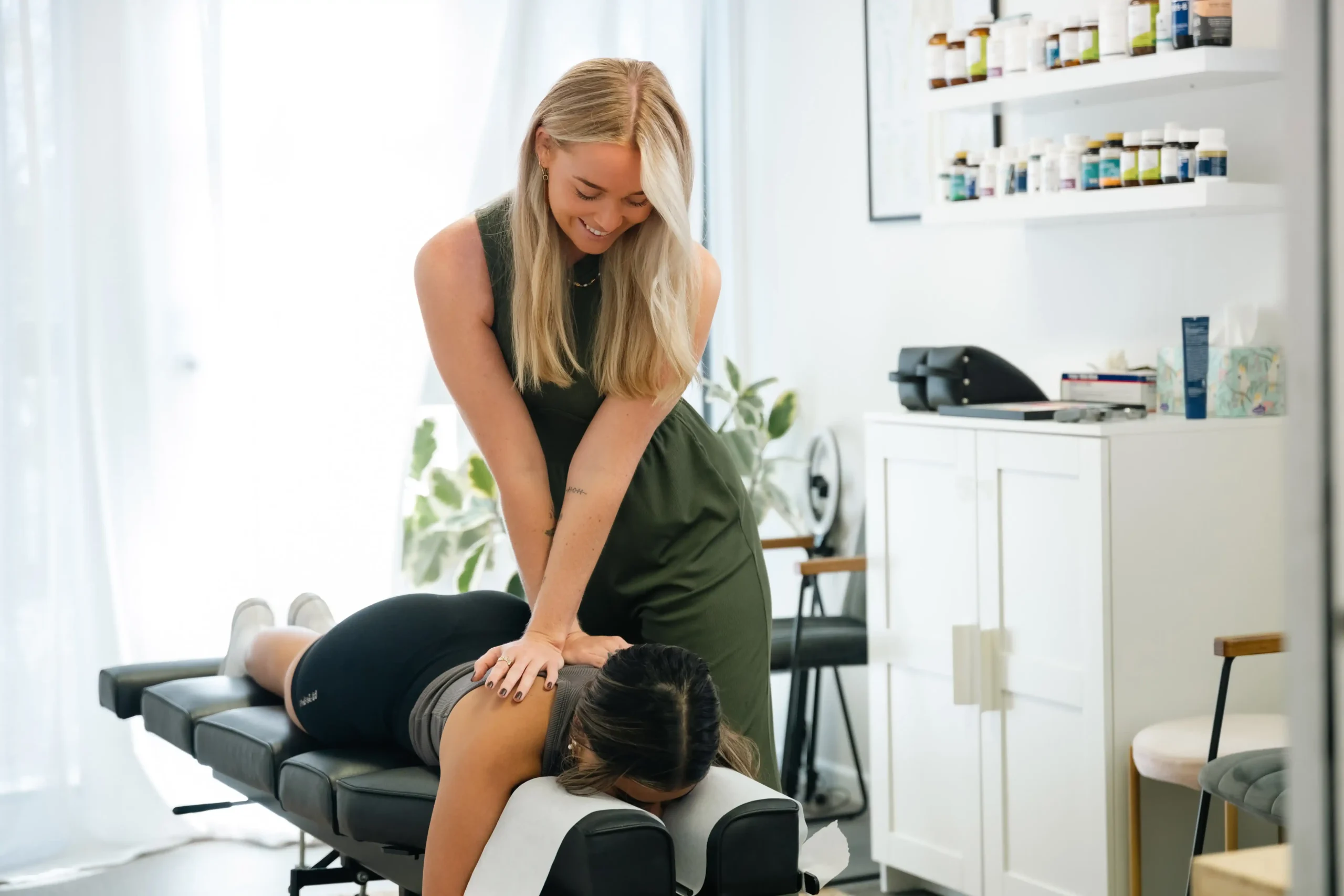 Chiropractic doctor helping patient